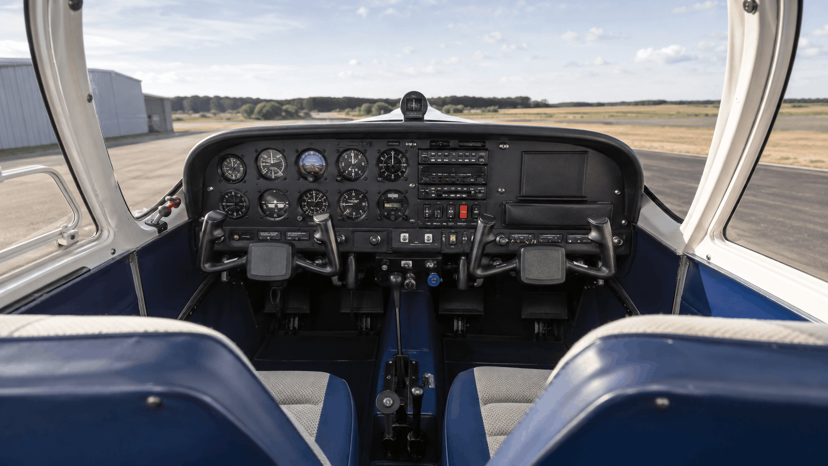 Classic light aircraft cockpit with analog instruments and modern avionics