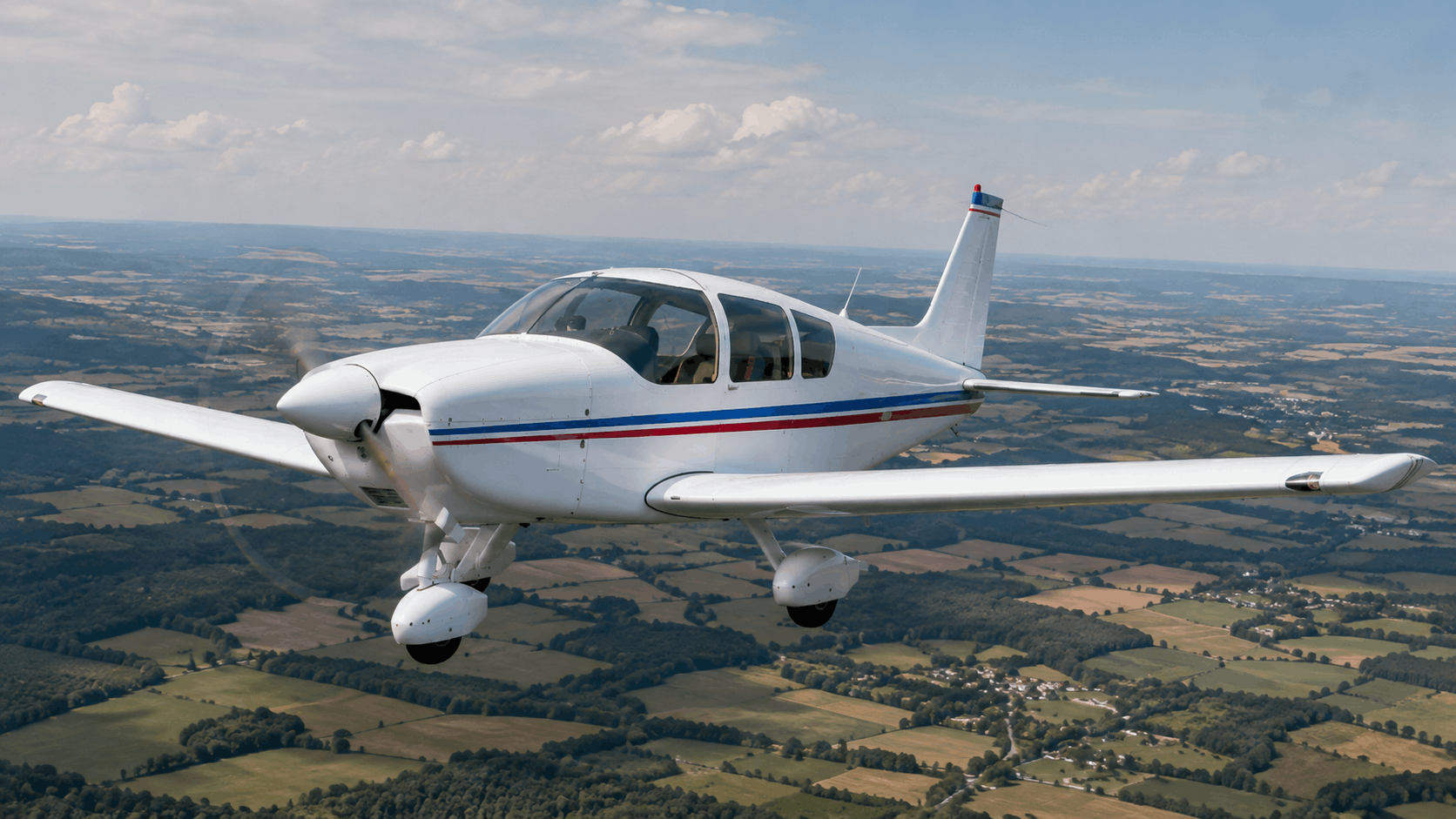 Robin HR100/210D-style four-seat touring aircraft on an airfield