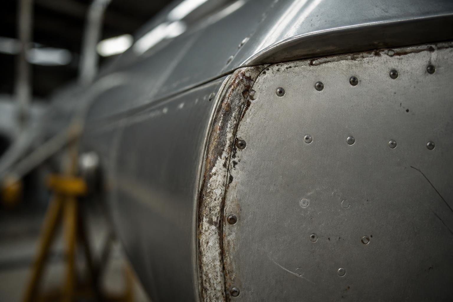 Close view of light corrosion around an aircraft aluminium panel and rivets