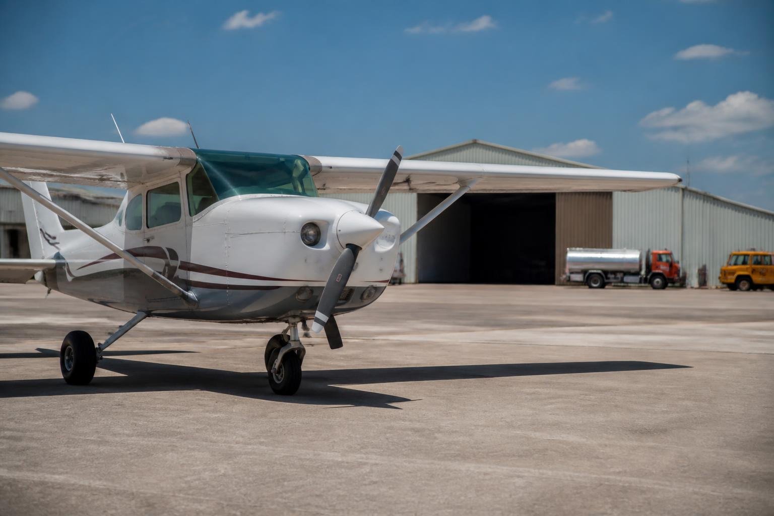 Light aircraft parked on an airport ramp