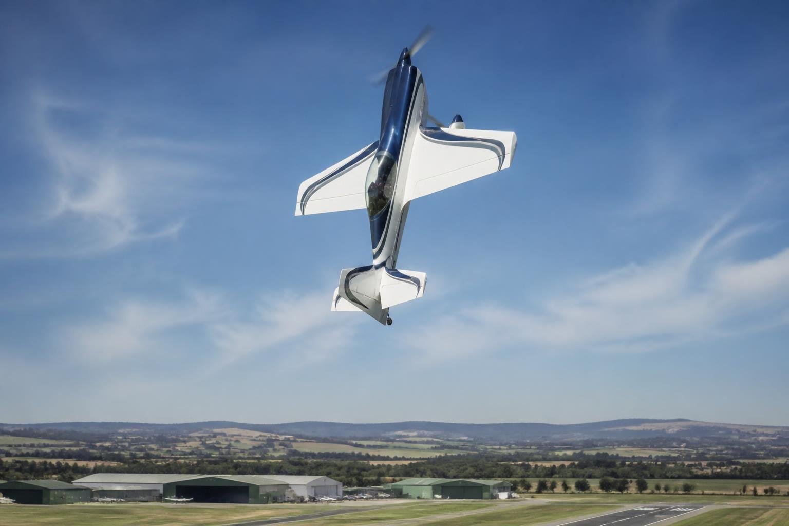 Single-seat aerobatic aircraft performing a vertical manoeuvre