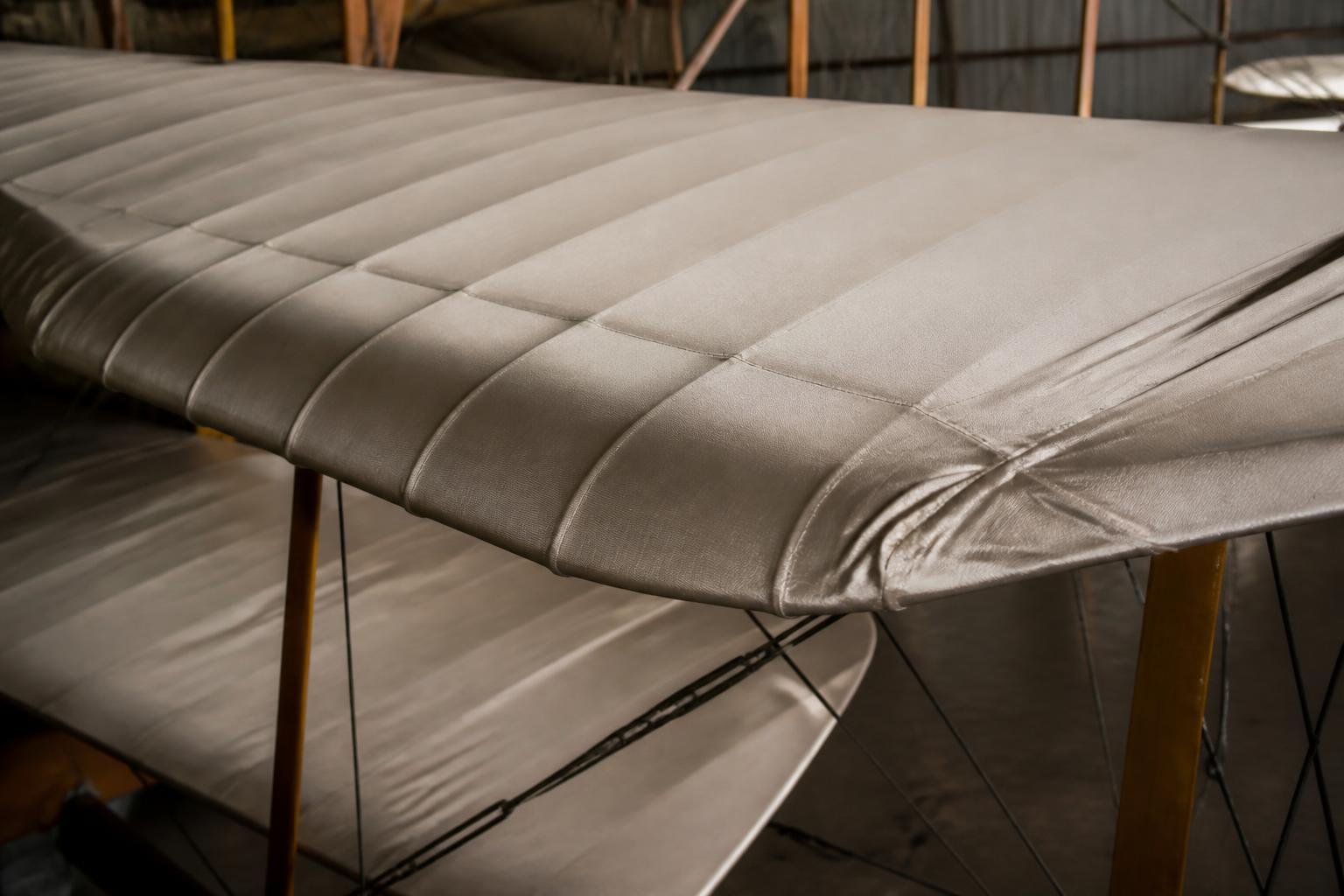 Fabric covering and rib stitching on a biplane wing