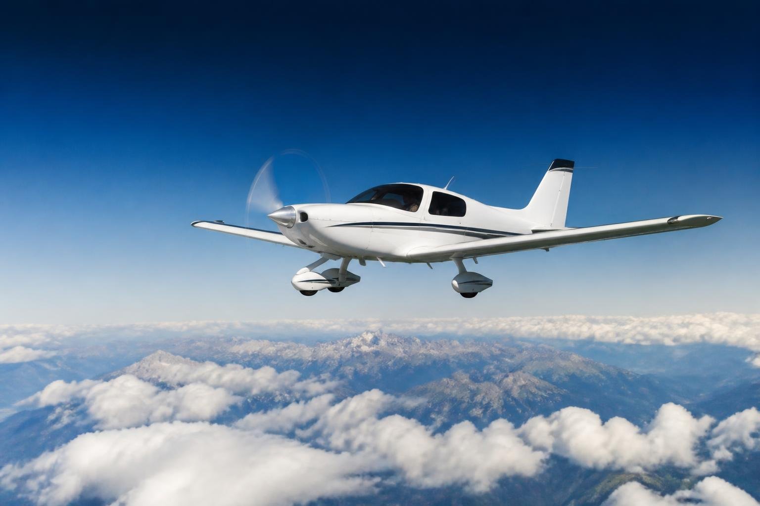 Piston aircraft cruising above a cloud layer at altitude